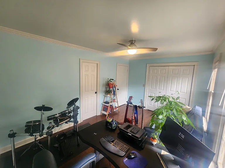 Second bedroom -- set up as an office with futon, facing front of house