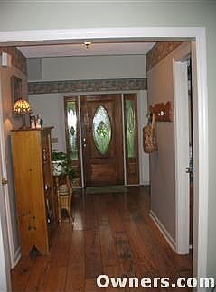 Foyer with wide-plank flooring
