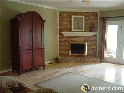 Very large den with gas logs overlooks pond