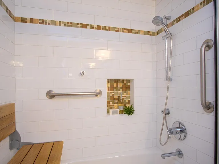 Bathroom with a fold up seat