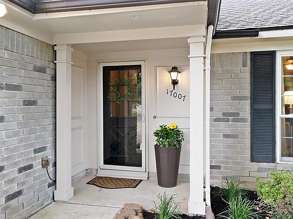 Excellent curb appeal with fresh plants and mulch, a beautiful rock border and landscape lighting.
