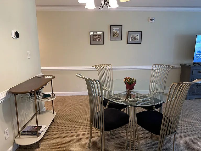Bar with glassware. Dining room seats 4.
