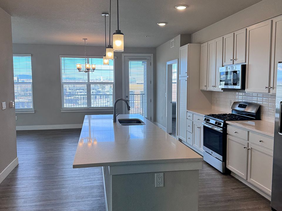 3 bedroom kitchen with white cabinets, upgraded appliances and stunning views!