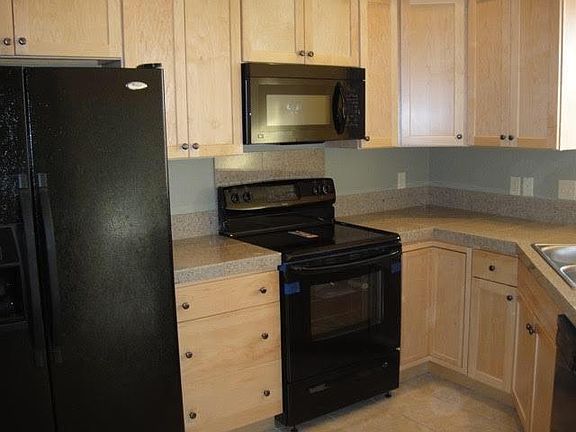 Beautiful cabinets with lots of storage. The Kitchen is open to Dining and Living areas with a snack bar. Granite countertops.