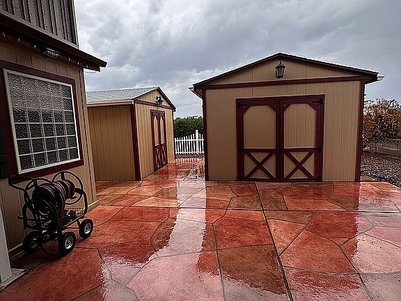 Sheds in back of carport 