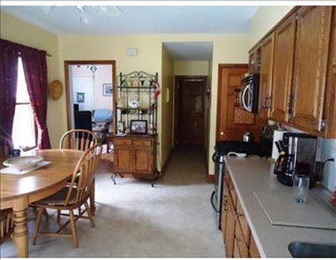Kitchen view from doors towards 1/2 bath and diningroom