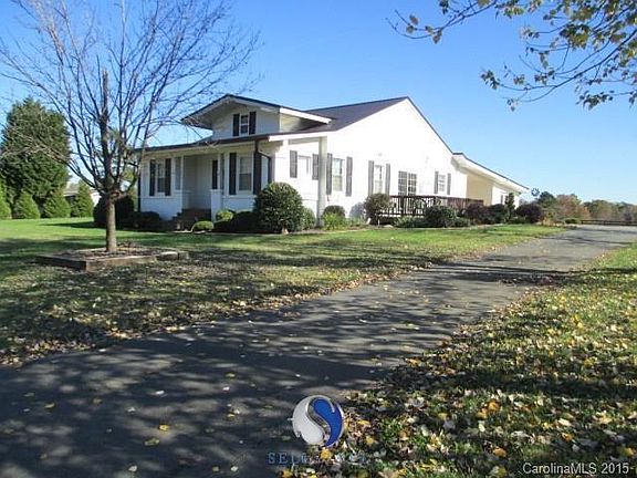Asphalt drive way. Attached carport. Side deck for entertaining and soaking up some Carolina sunshine