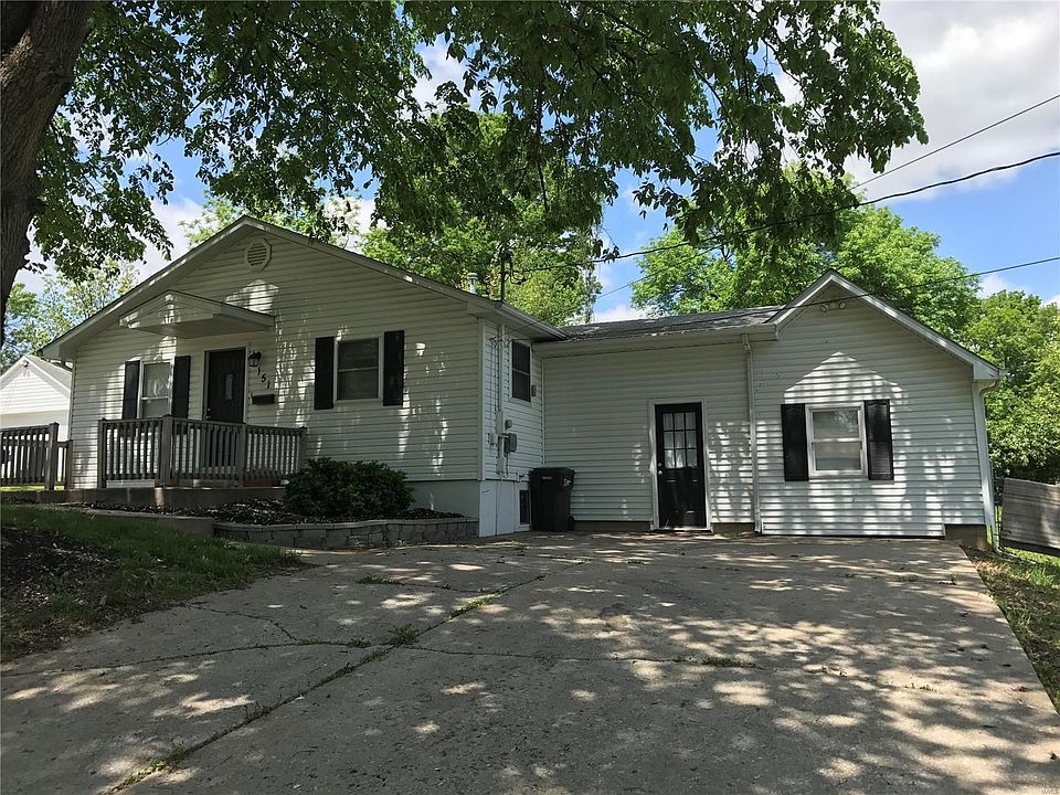 Lovely shaded front porch and home.