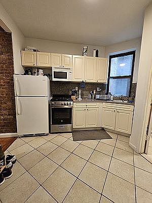 1st image of 312 E 9th St APT 7