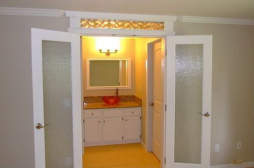 Custom French doors to master bath and walk in closet.