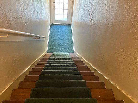 Stairwell from the front door to the apartment. There is a small landing at the top, you could have a table, mirror, coatrack, etc...