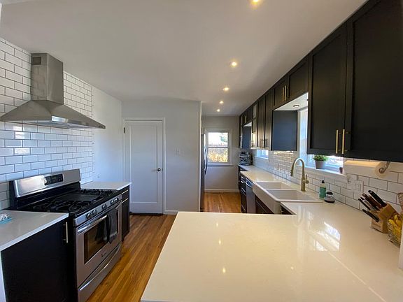 Gorgeous Kitchen with Quartz countertops and brass finishes