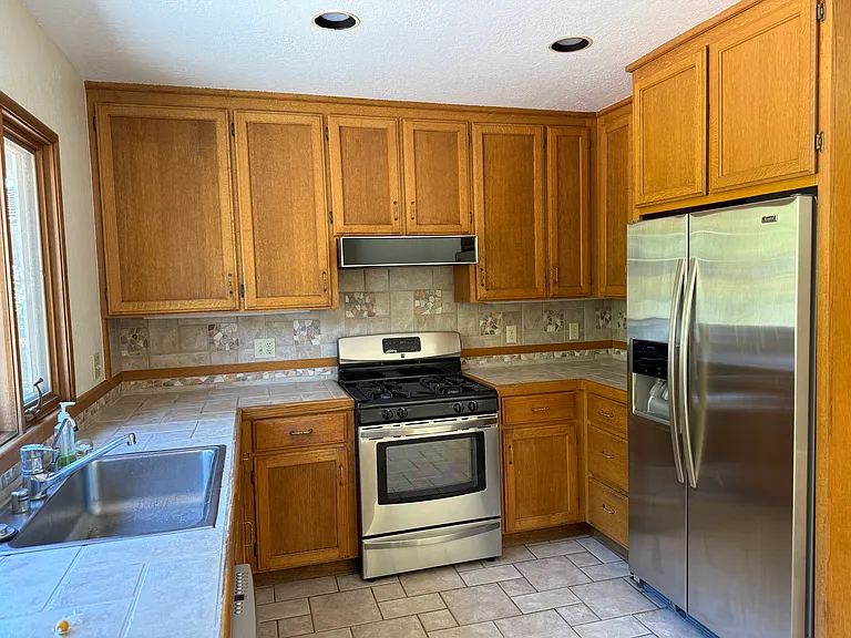 Kitchen with stainless steel appliances.