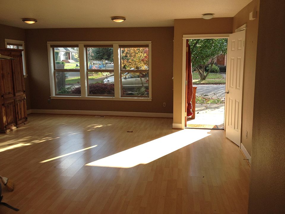 View of open front door from kitchen island