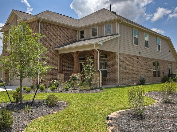 This charming home features covered front & back porches, sprinkler system, high ceilings, energy features, crown molding, & arched doorway accents.