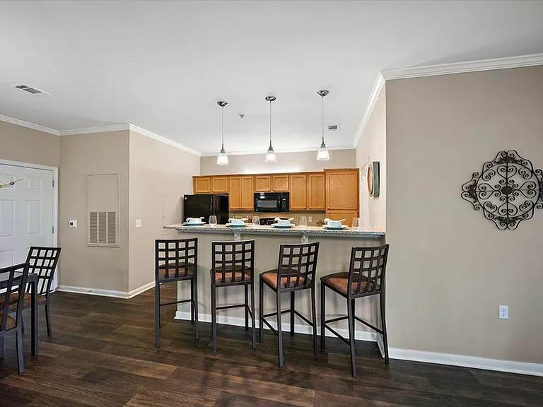 Experience Open-Concept Living with Breakfast Bar Seating in the Kitchen at Eagle Flatts Apartments in Hattiesburg