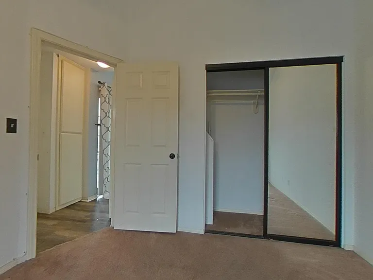 Primary bedroom view into the hallway