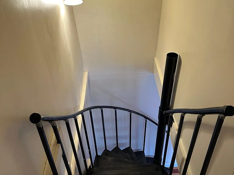 spiral staircase to upstairs/downstairs