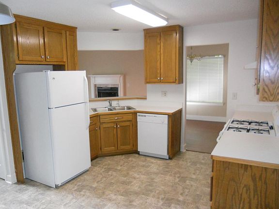 Spacious kitchen with modern appliances and new flooring