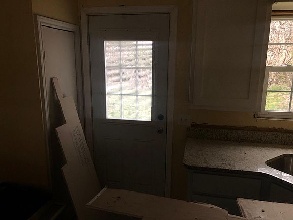 New kitchen custom cabinets, new marble counter tops. New door. New tile floor.