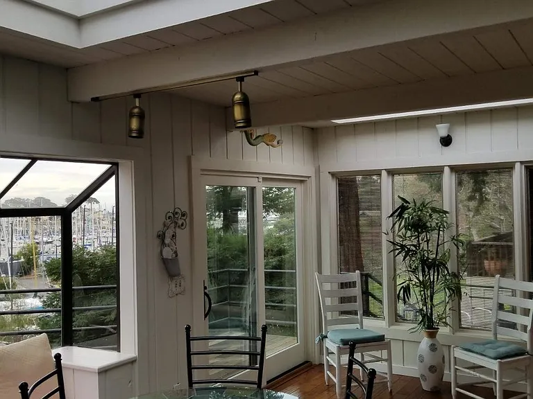 Sun room with harbor views, skylights, and extra seating areas