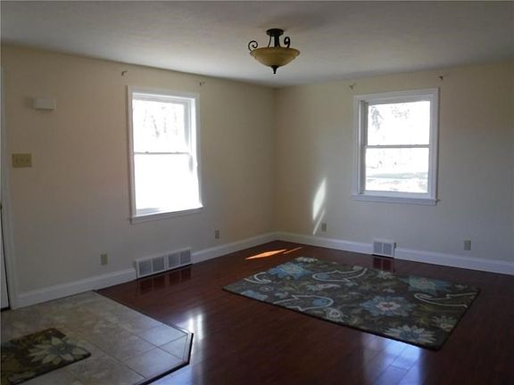 Lovely tiled entryway, to warm hardwood floors throughout the house.  This family has so much light and warmth.  Waiting for you