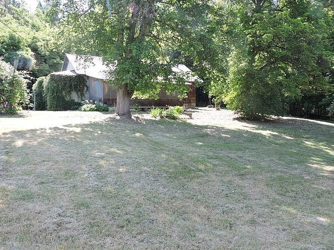 FRONT AREA VIEW OF SUBJECT FROM ACCESS ROAD.