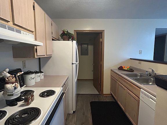 Kitchen and entry to utility closet.