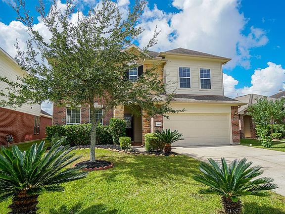 You will fall in love with the curb appeal of this 2 story brick home with sophisticated landscaping.