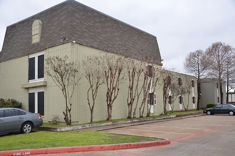 side view of 1 of the apartment buildings and parking area