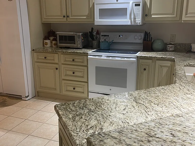 Kitchen with granite countertops.