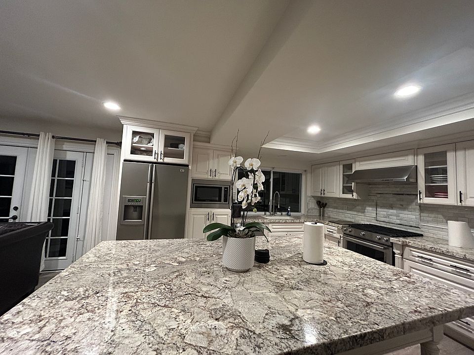 Large renovated kitchen with granite island
