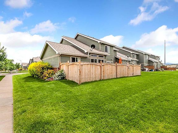 Small, private, fenced backyard which opens to HOA common area.