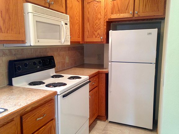 Kitchen with ceramic tile black splash