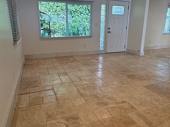 Family room with ceiling fan.