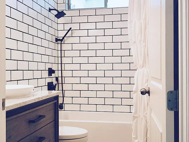 Hallway bathroom with custom tile