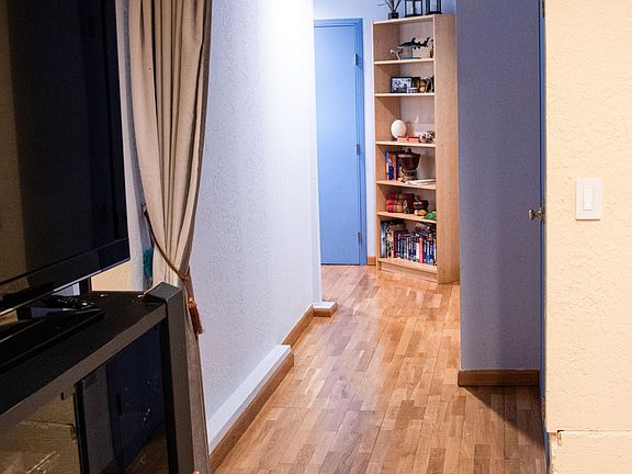 View from the second room to hallway leading to master bedroom
