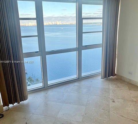 large 2cd bedroom with wall to wall bight view of view