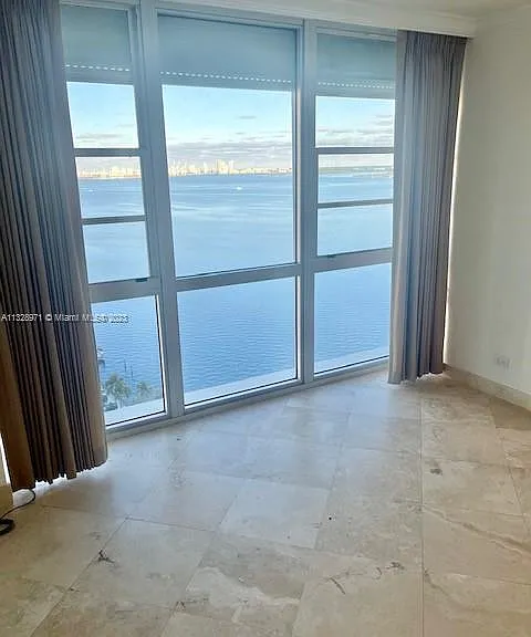large 2cd bedroom with wall to wall bight view of view