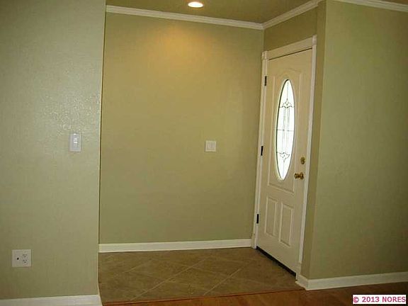Tiled Entry with Crown Molding and New Door