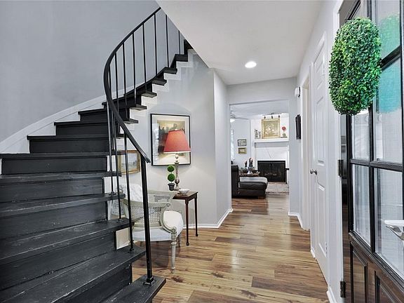 Dramatic spiral wrought iron staircase entrance !