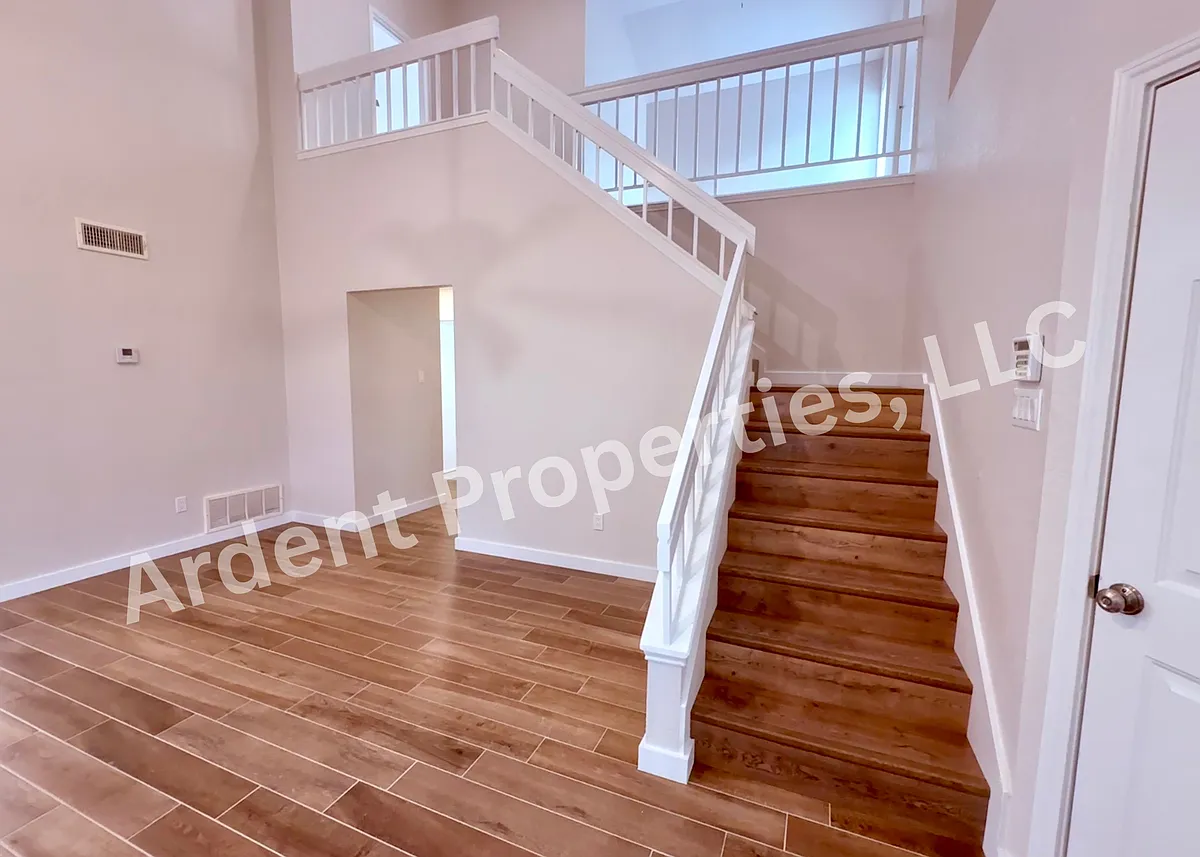 Living room and stairs - 6315 Settlement Dr