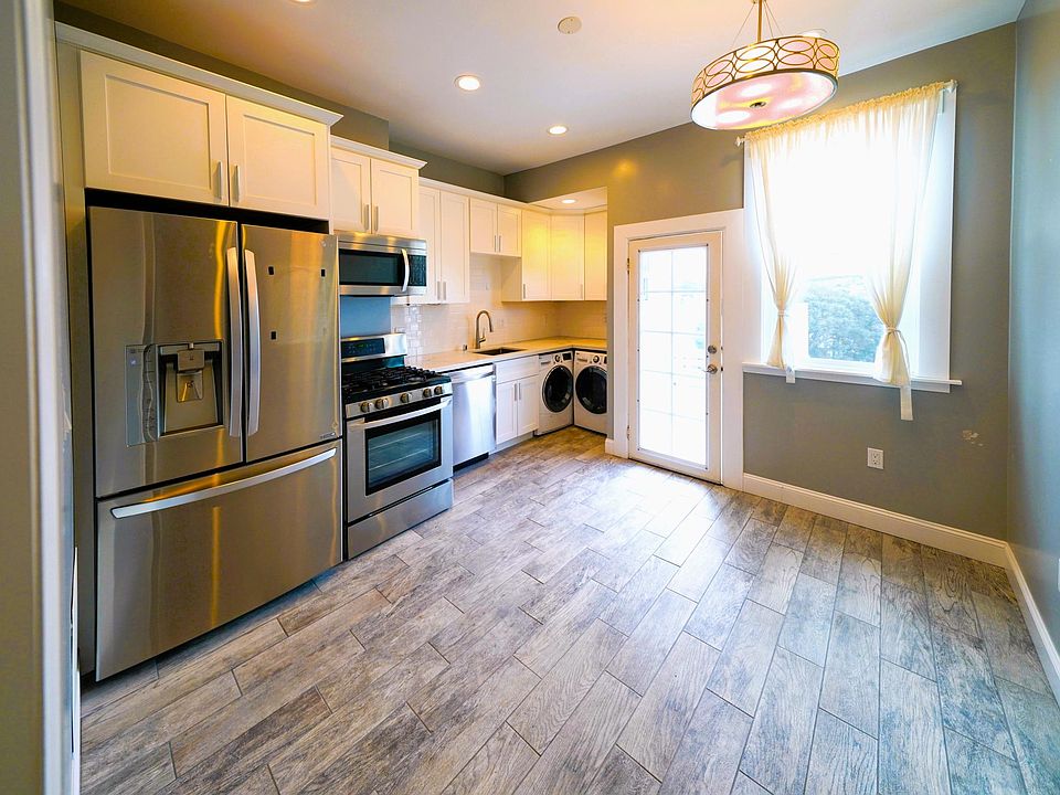 Modern Stainless Steel kitchen, with 5 burner gas stove, 3 door refrigerator, micro oven, dishwasher, garbage disposal.