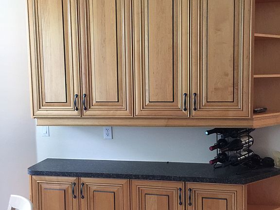 Cabinetry by eat-in kitchen 