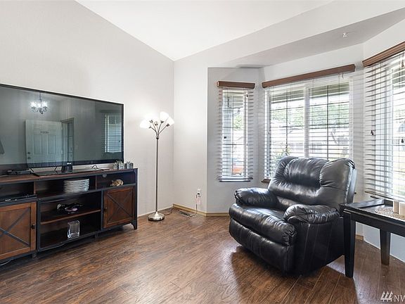 The living room has huge bay windows that brings in lots of natural light!