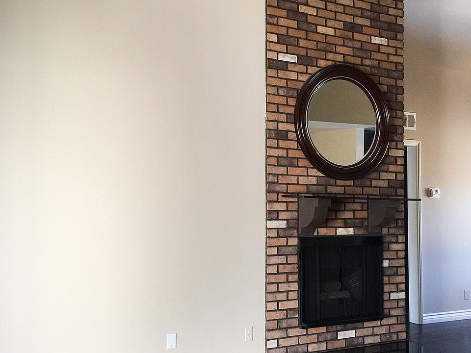 High ceilings, gas fireplace, 2 patios and more!