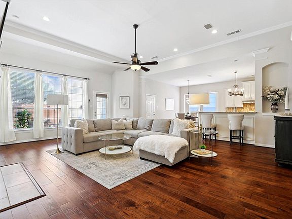 The open concept home features bright windows and high ceilings througout