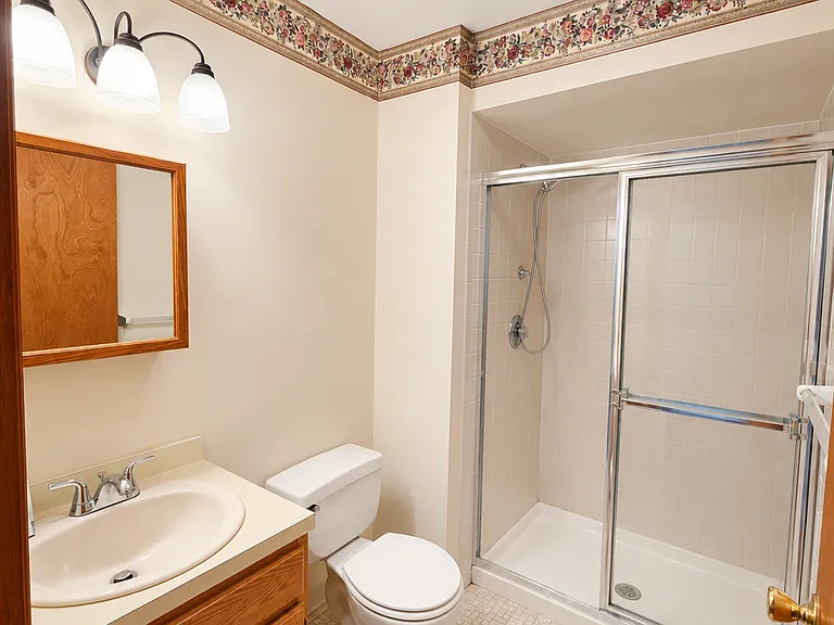 Full bathroom with shower and clean neutral finishes