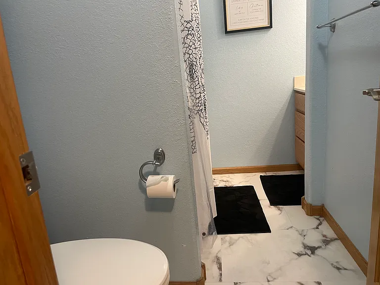 Lower level bathroom tub/shower combo.