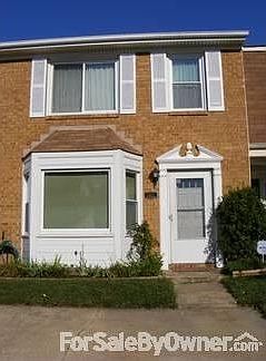 1512 Jameson : Jasmine vine on the right, tulips, roses, iris, and daylily's